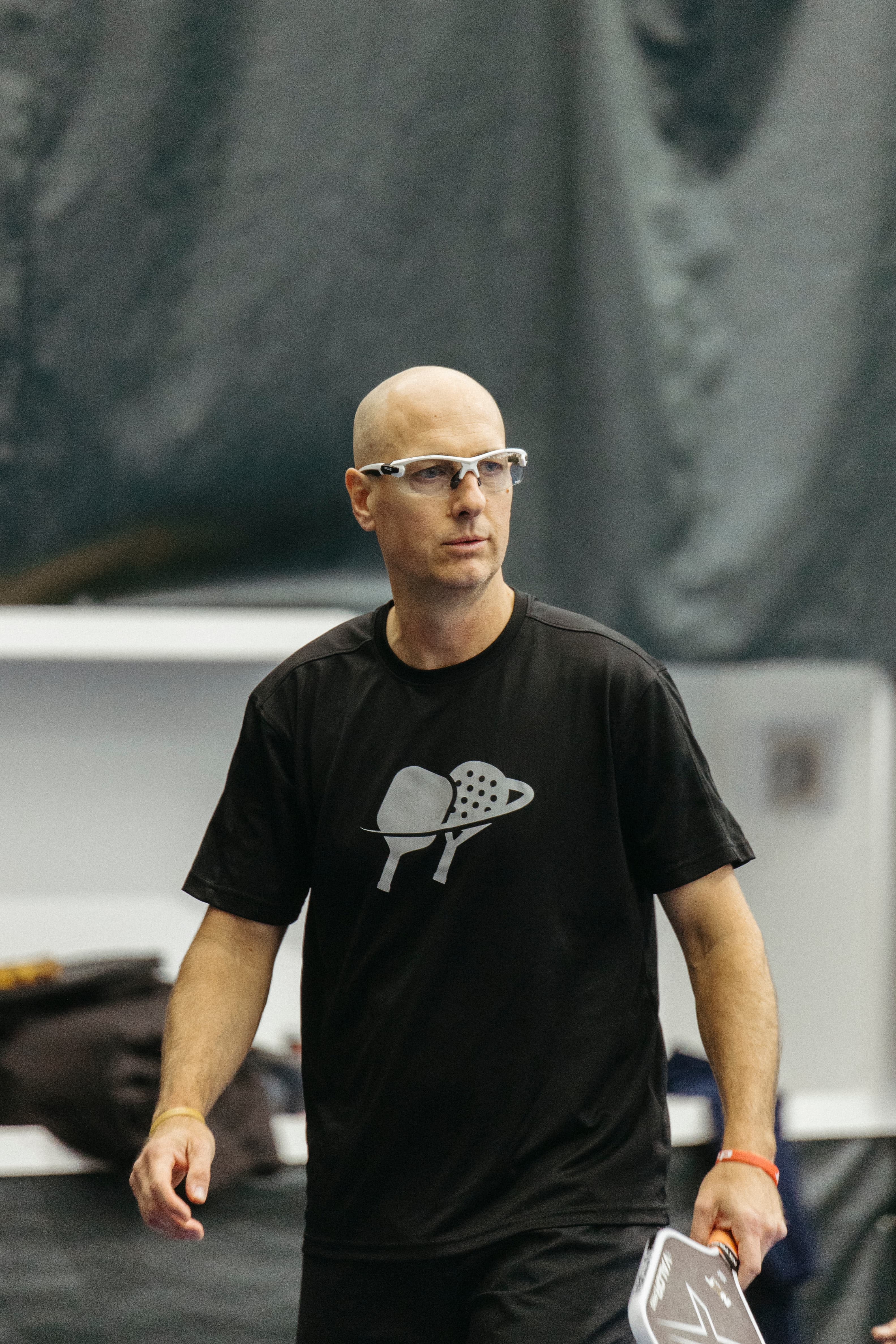 Senior male pickleball player at a Klyng Senior Open stop